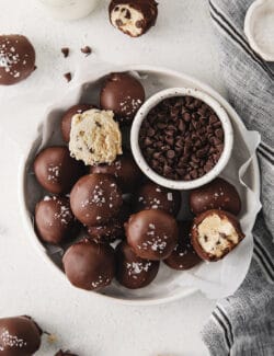 Overhead view of cookie dough truffles on a white plate