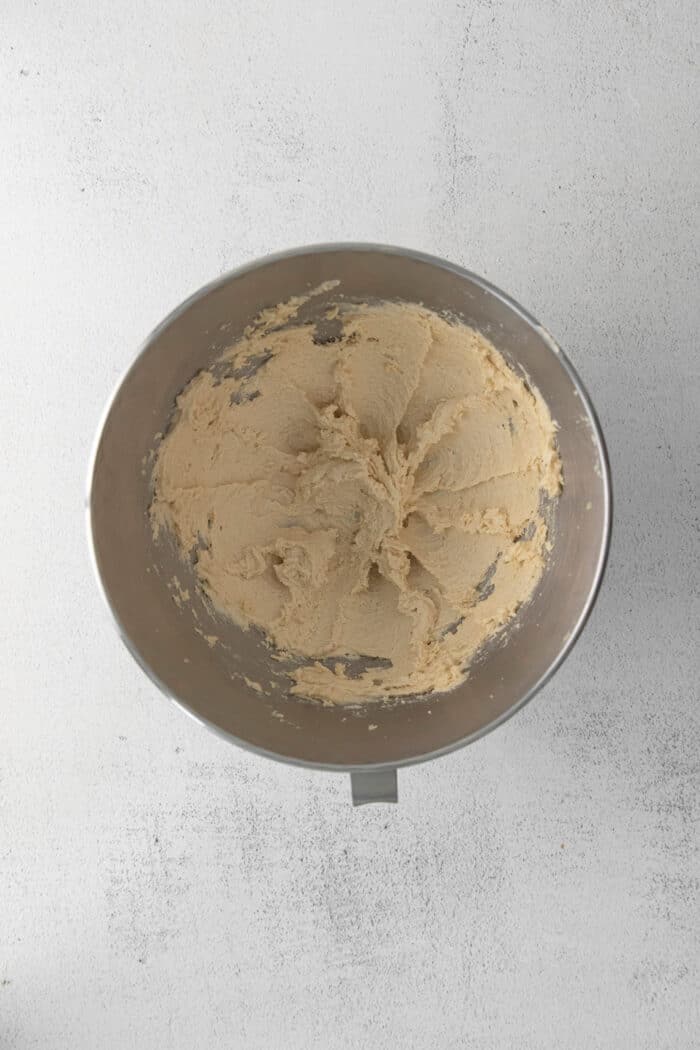 Whipped butter and sugar in a mixing bowl