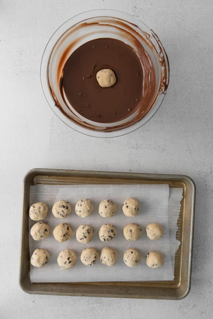 Cookie dough balls and a bowl of melted chocolate