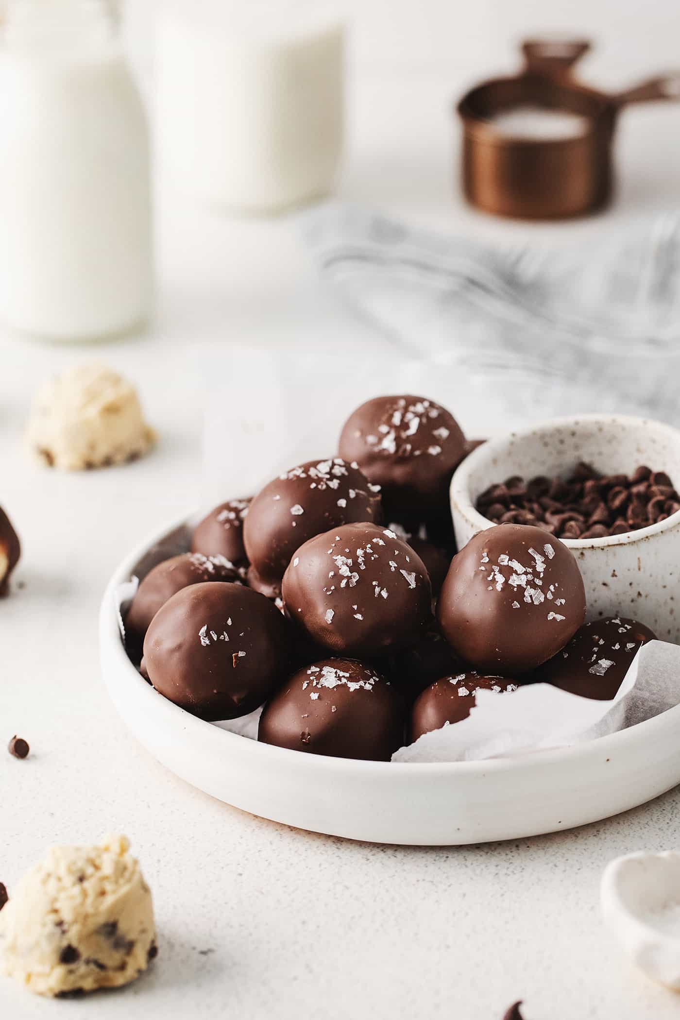 A plate of chocolate cookie dough truffles