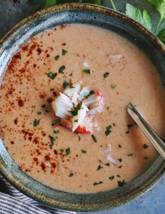 a bowl of creamy soup with crab meat