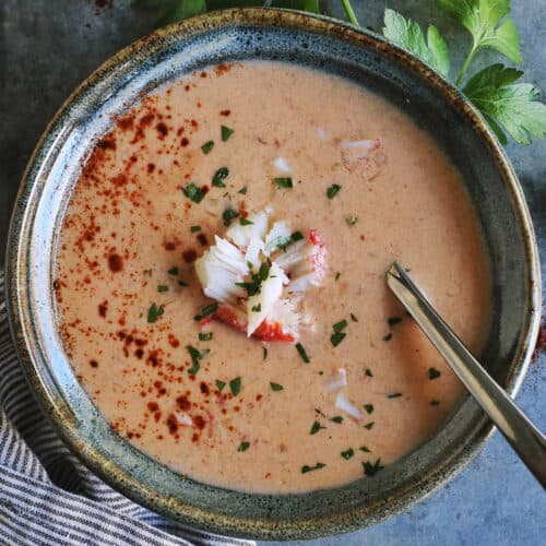 a bowl of creamy soup with crab meat