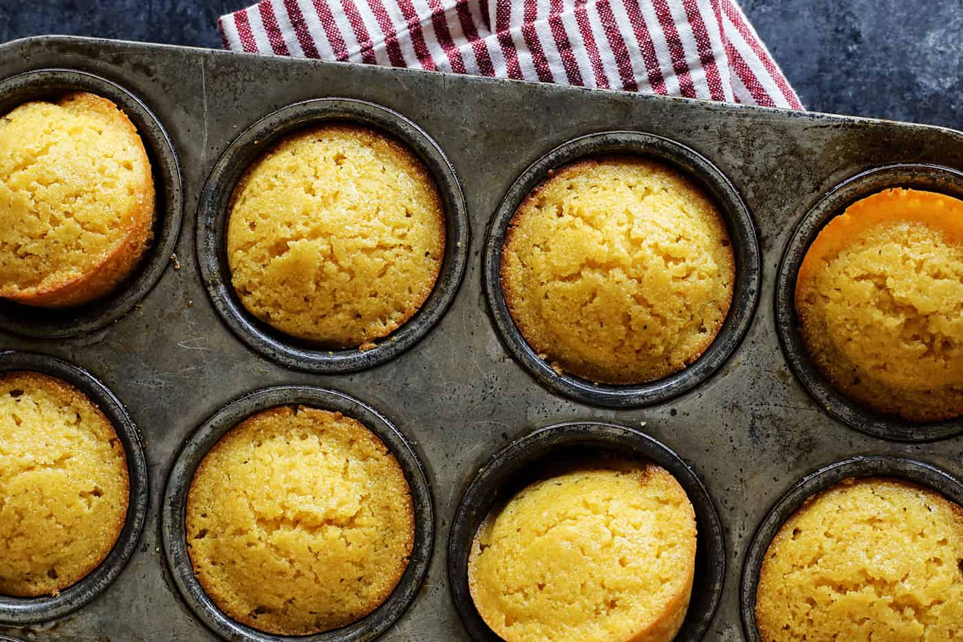 overhead photo of cornbread muffins in a pan