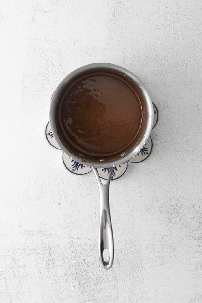 Overhead view of hot fudge sauce in a sauce pan