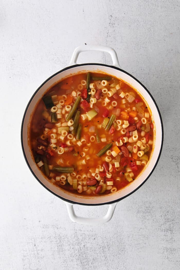 Overhead view of classic minestrone soup in a pot