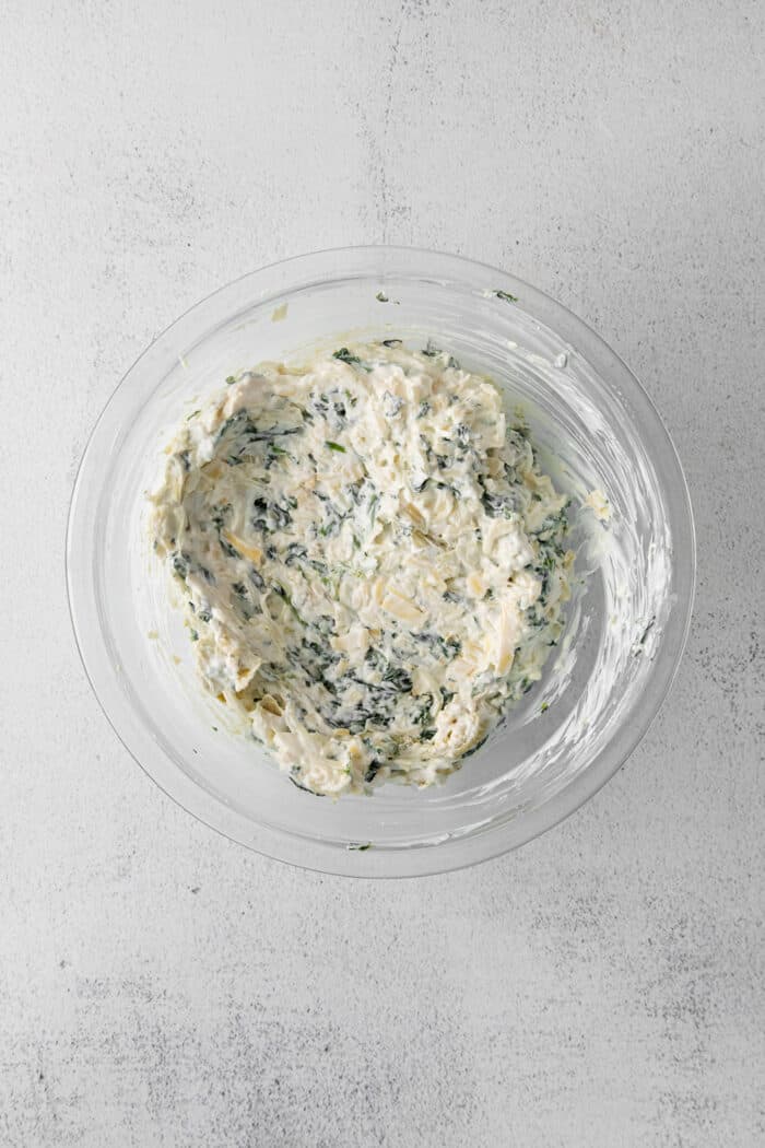Spinach and artichoke dip mixture in a bowl