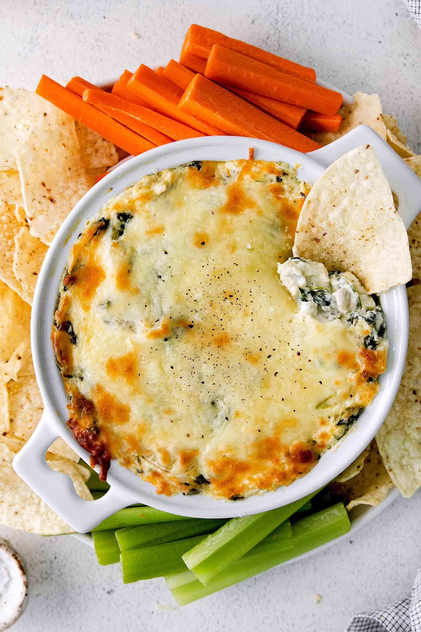 Overhead view of a bowl of spinach artichoke with