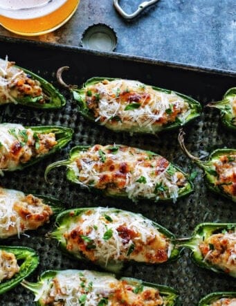 halved jalapeno peppers stuffed with Italian sausage and cheese