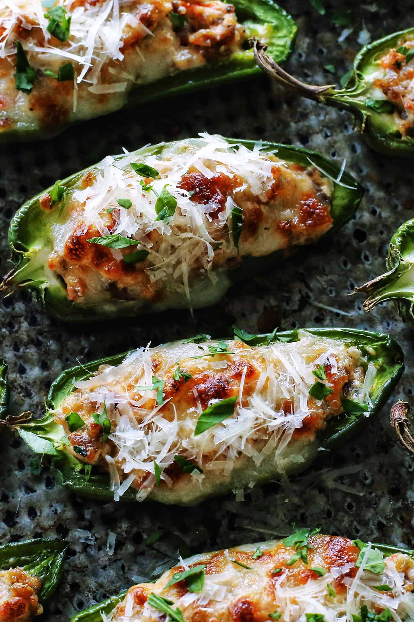 close-up overhead photo of baked stuffed jalapeno peppers