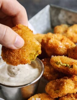 dipping fried pickles into ranch dip