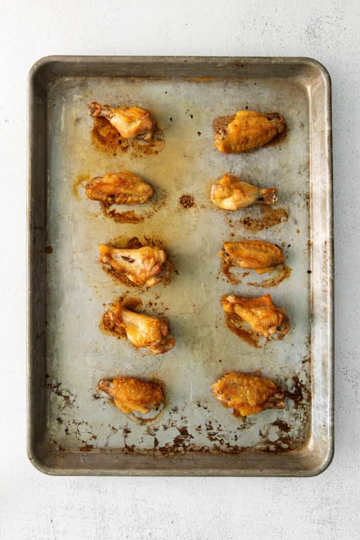 Crispy baked chicken wings on a baking sheet