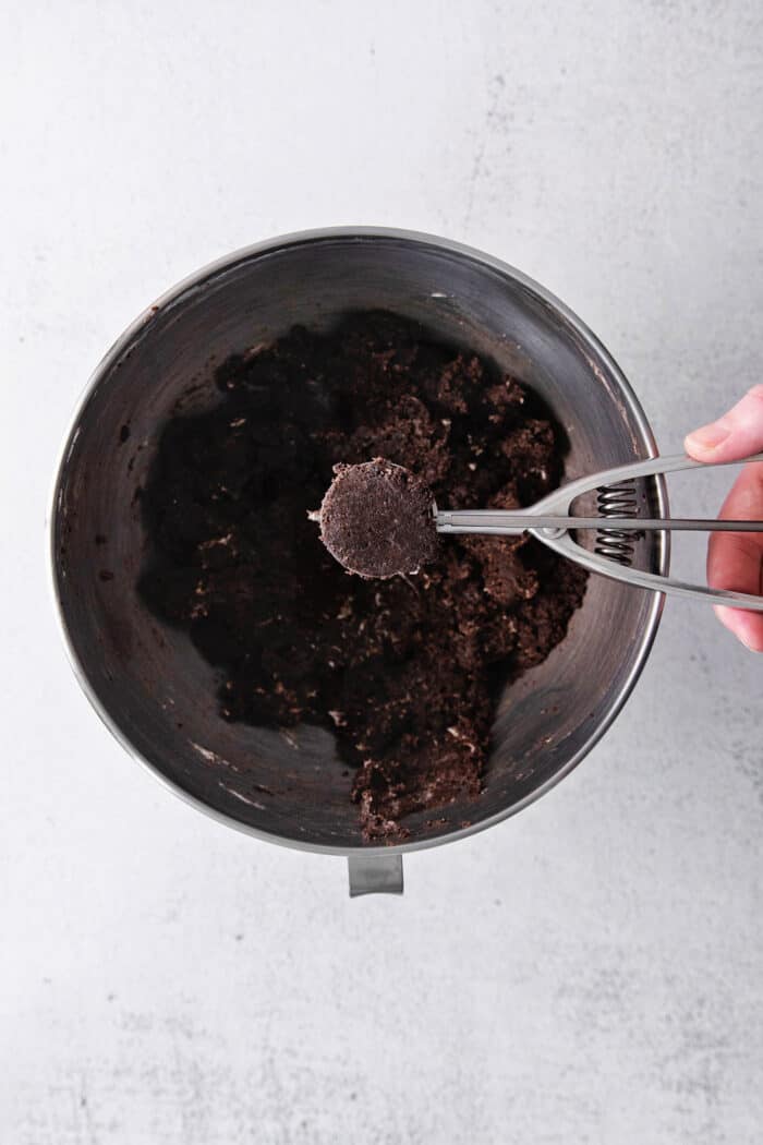 A cookie dough scoop with Oreo truffle mixture