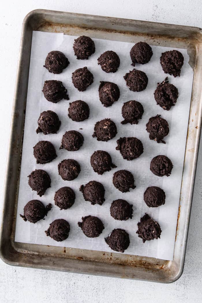 Balls of Oreo truffle filling on a baking sheet