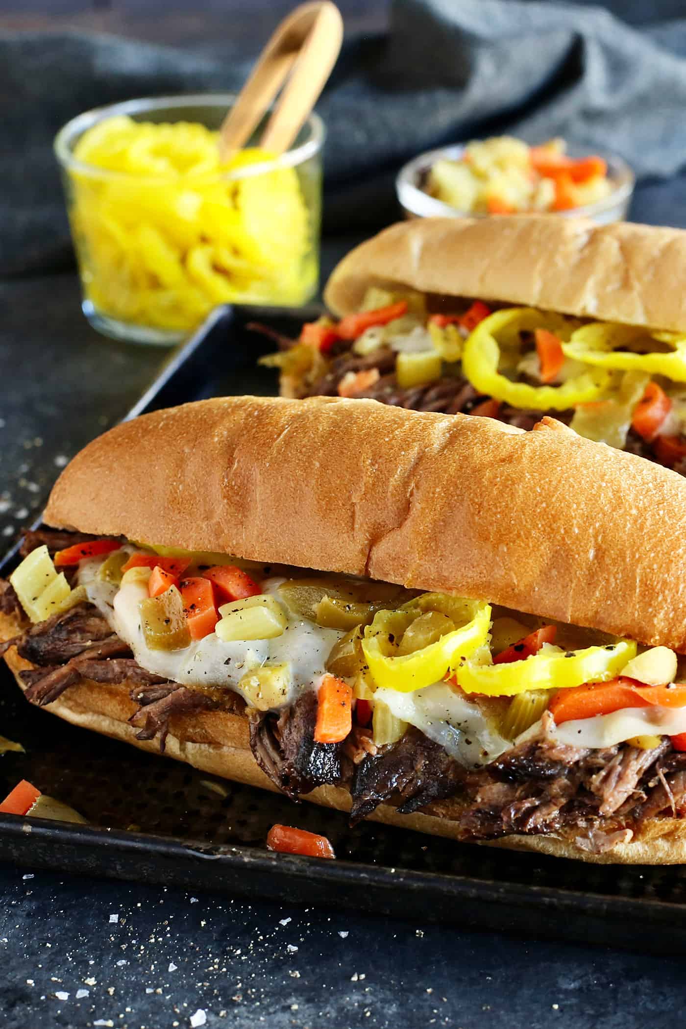 angled view of 2 Italian beef sandwiches