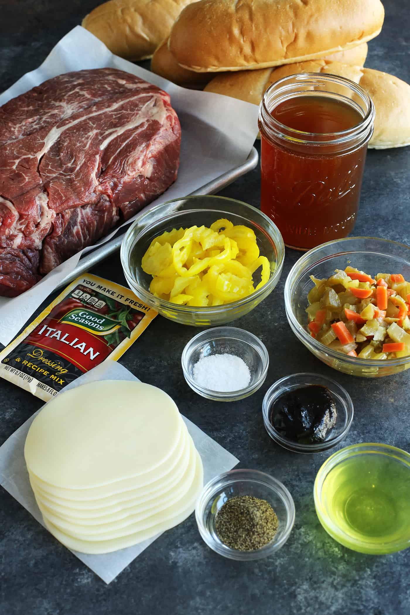 Overhead view of slow cooker Italian beef ingredients