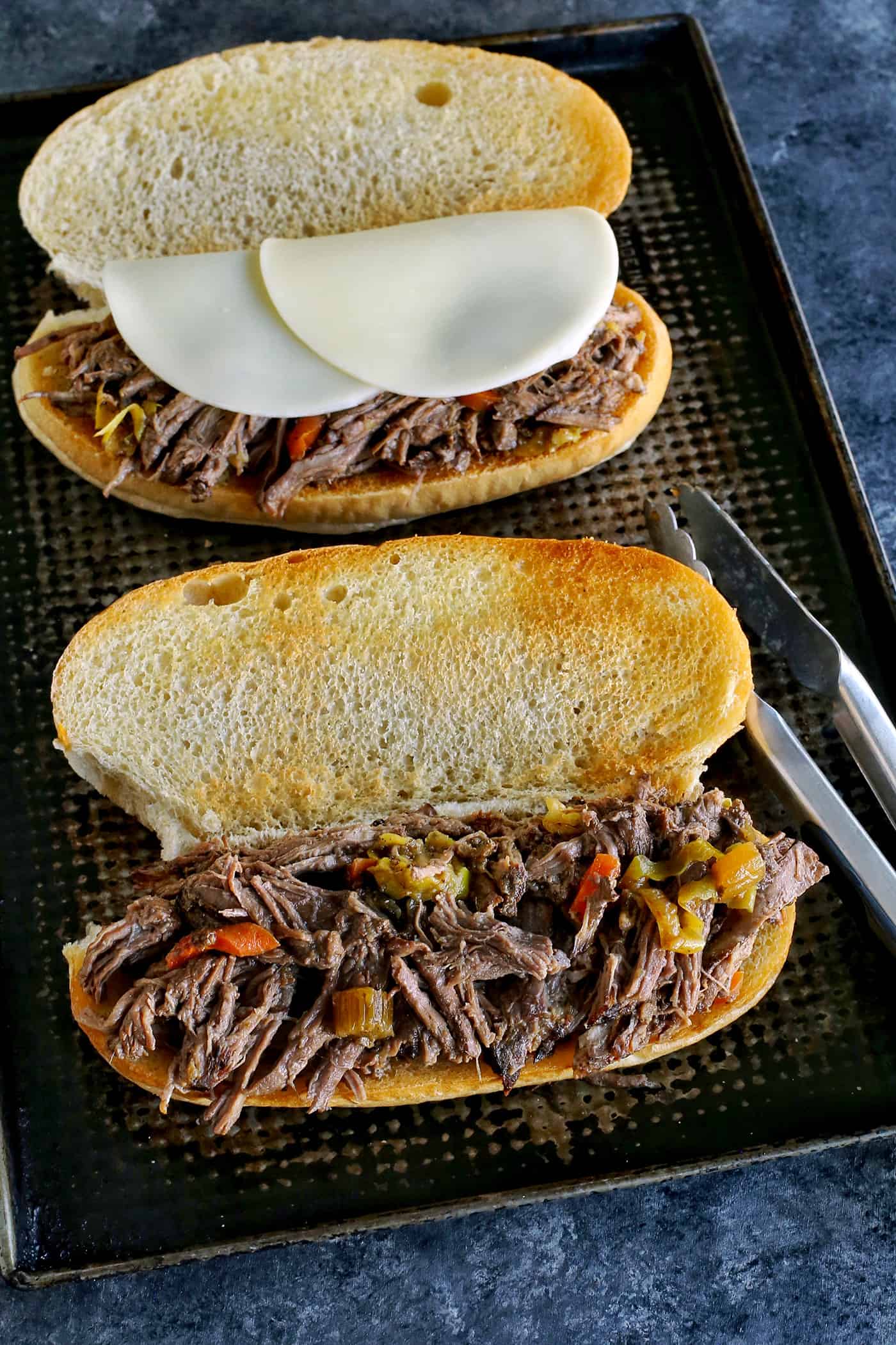 Italian beef on an open toasted hoagie roll