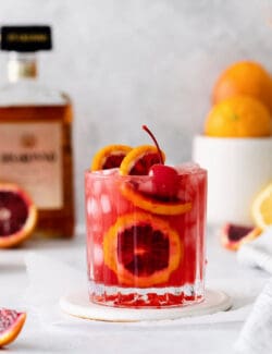 blood orange amaretto sour in a cocktail glass