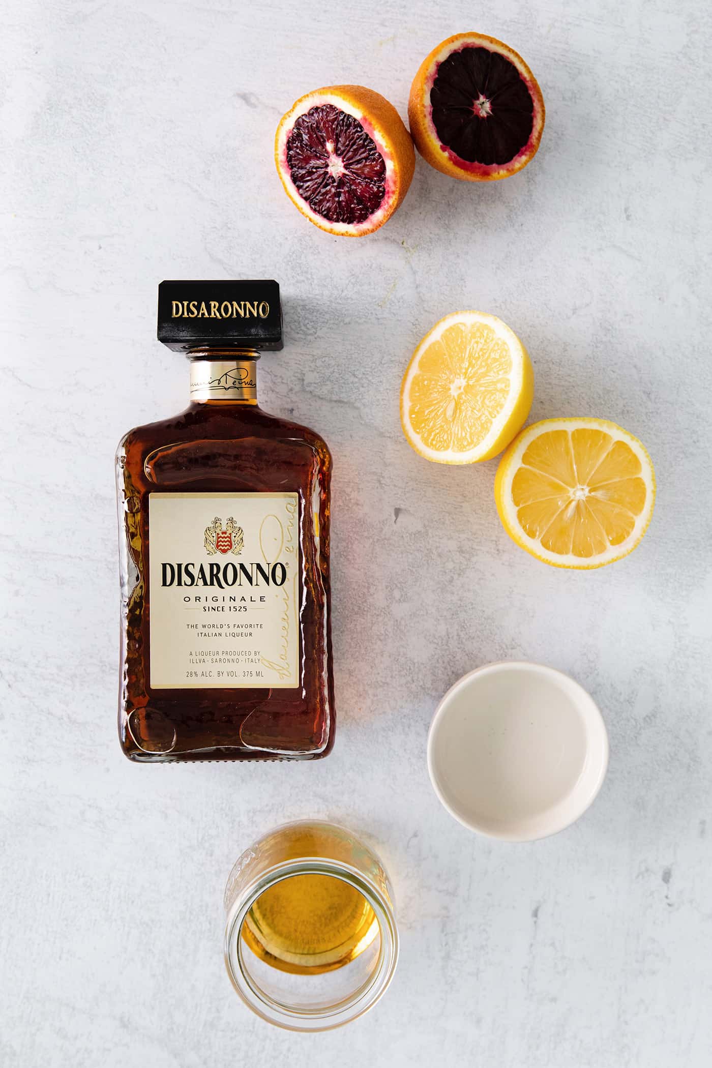 ingredients to make a blood orange amaretto sour drink