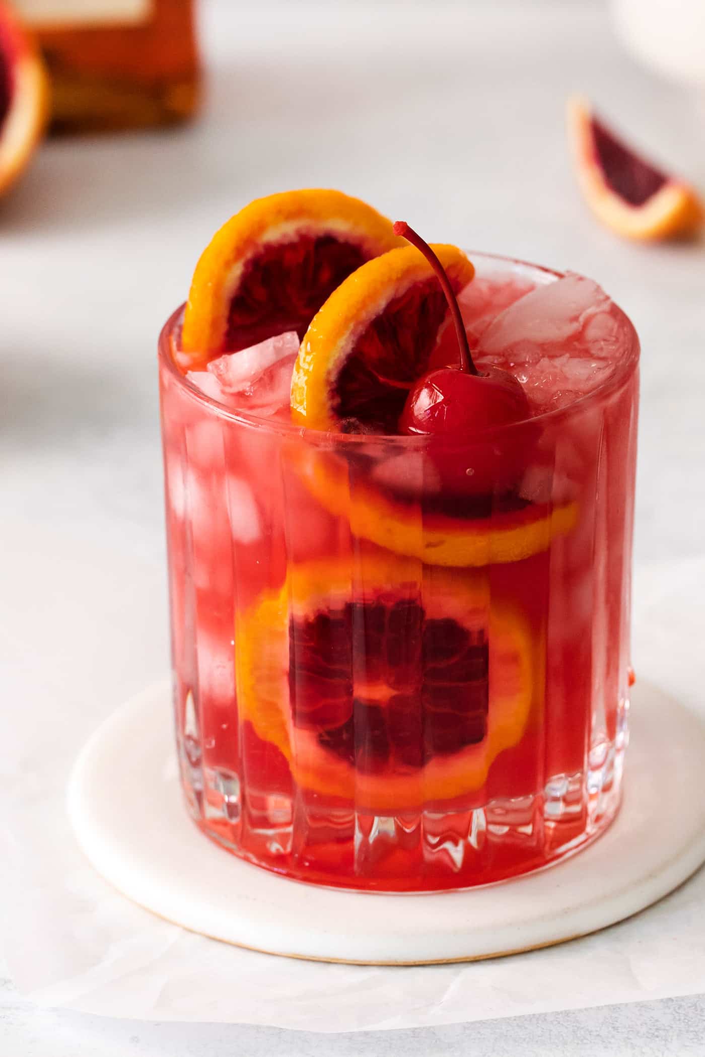 up-close photo of blood orange amaretto sour in a cocktail glass