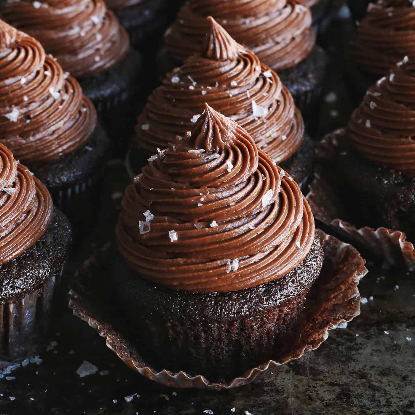 Close up of chocolate buttercream on cupcakes