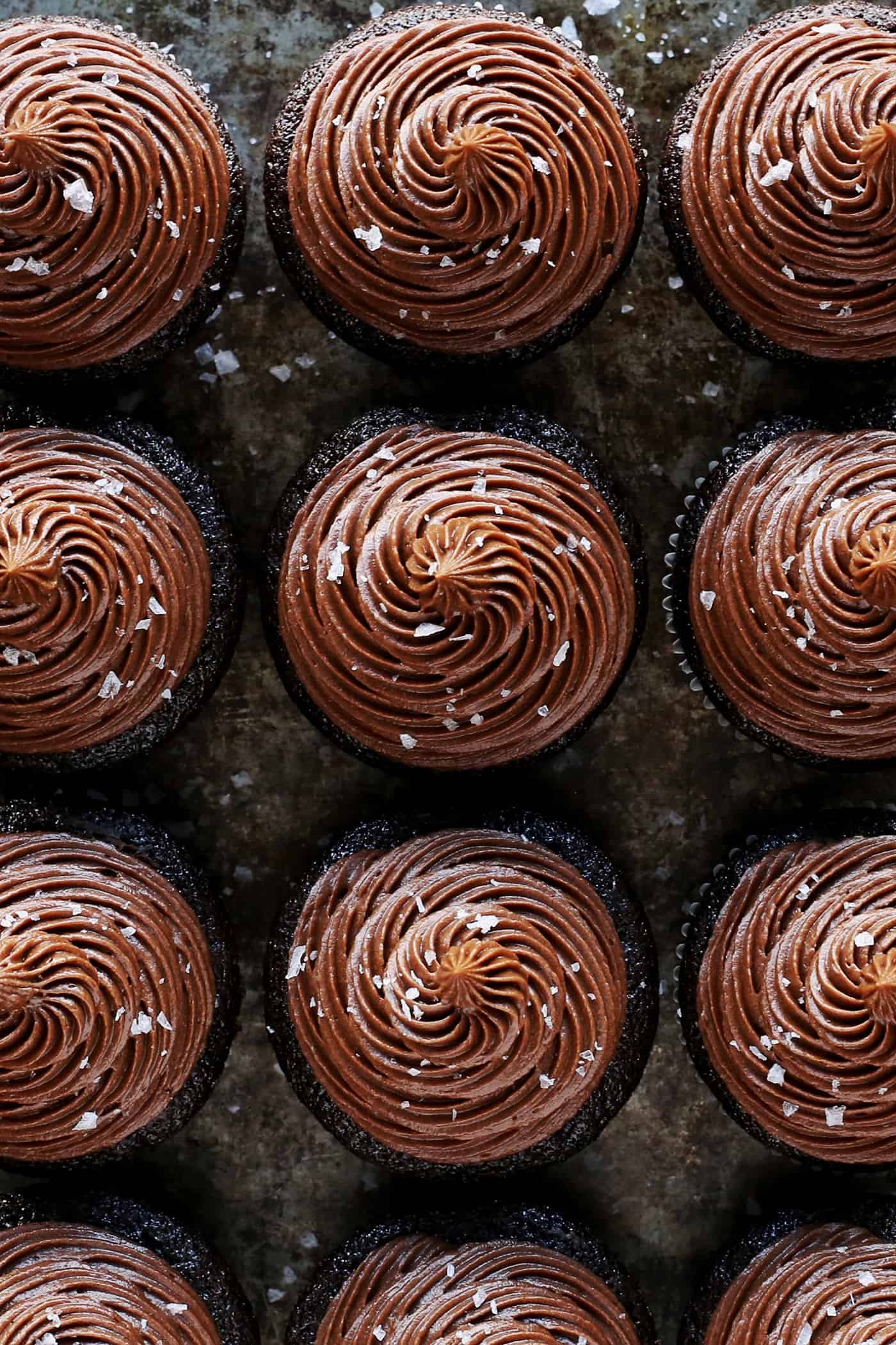 Overhead view of chocolate buttercream on cupcakes