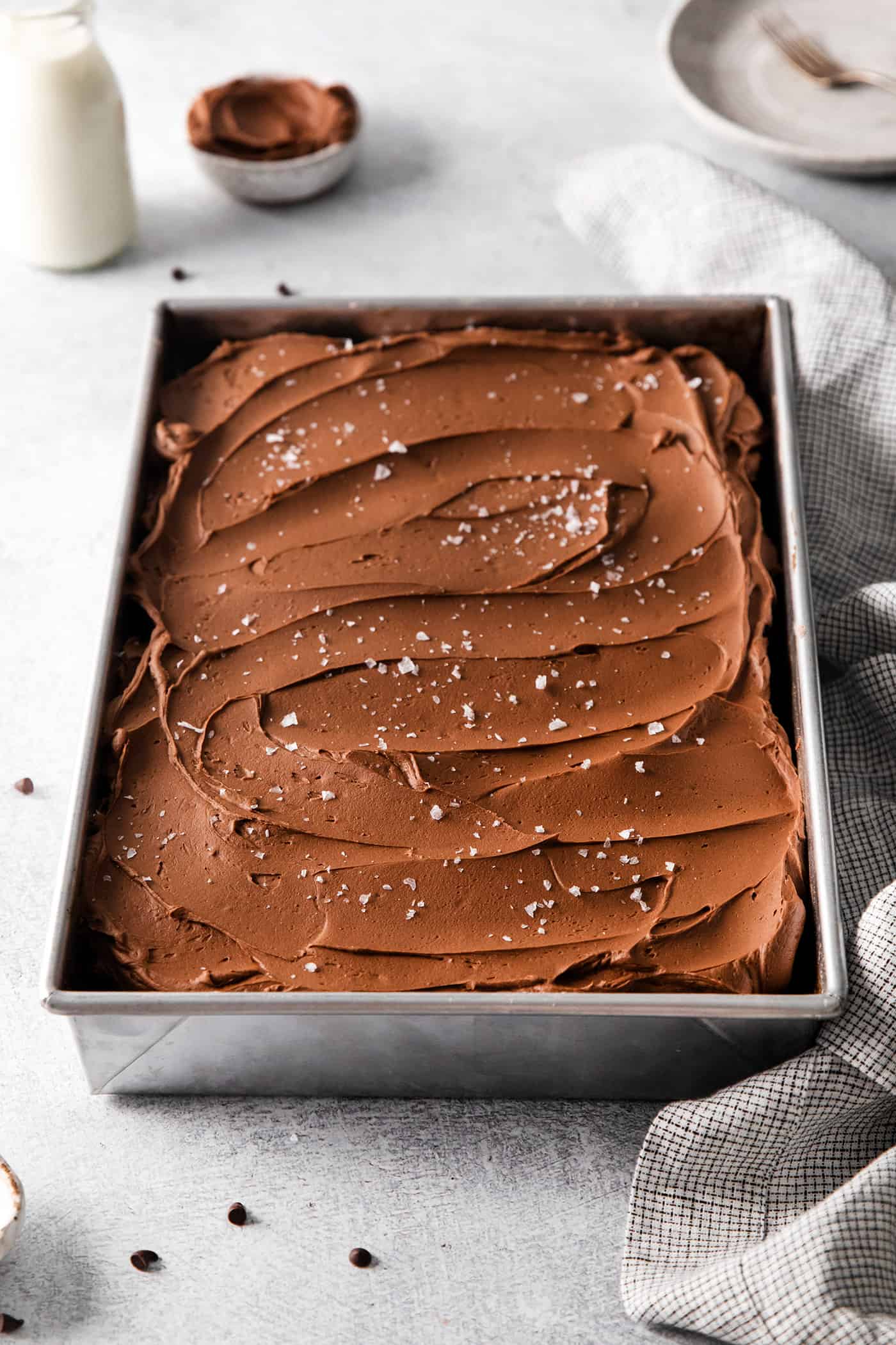 Overhead view of a pan of chocolate wacky cake with buttercream frosting