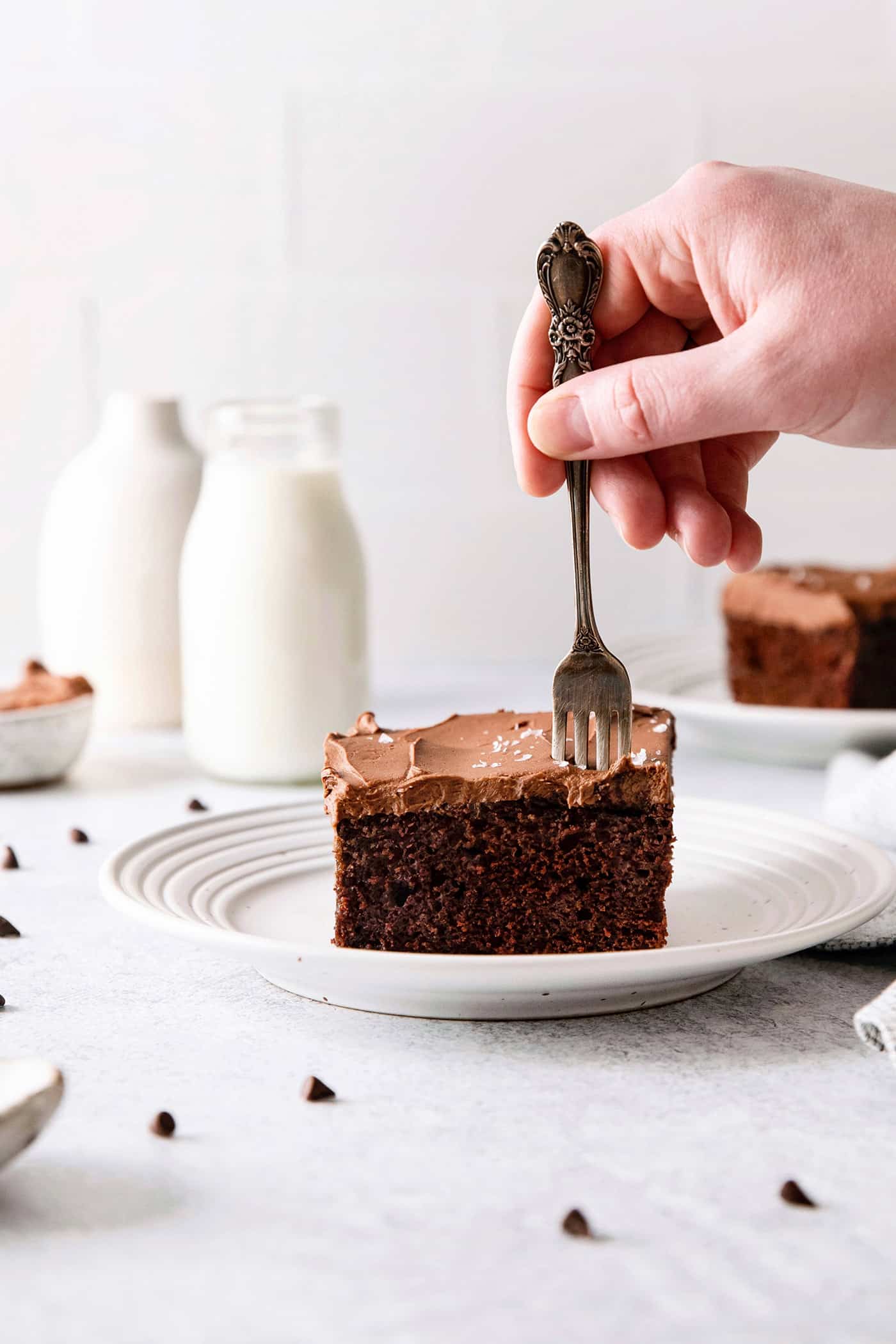 A fork in a slice of chocolate wacky cake