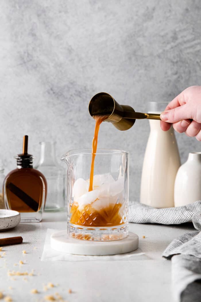 pouring Kahlua into the cocktail glass