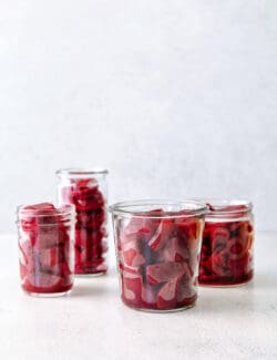 four jars of cubed beets