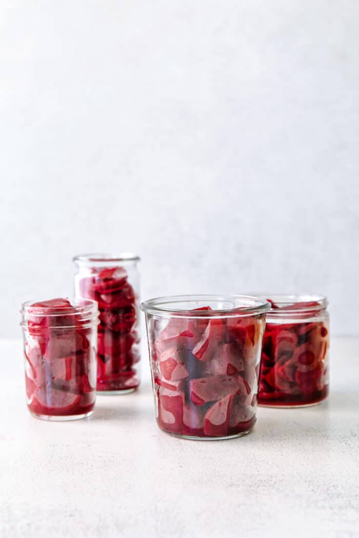 four jars of cubed beets