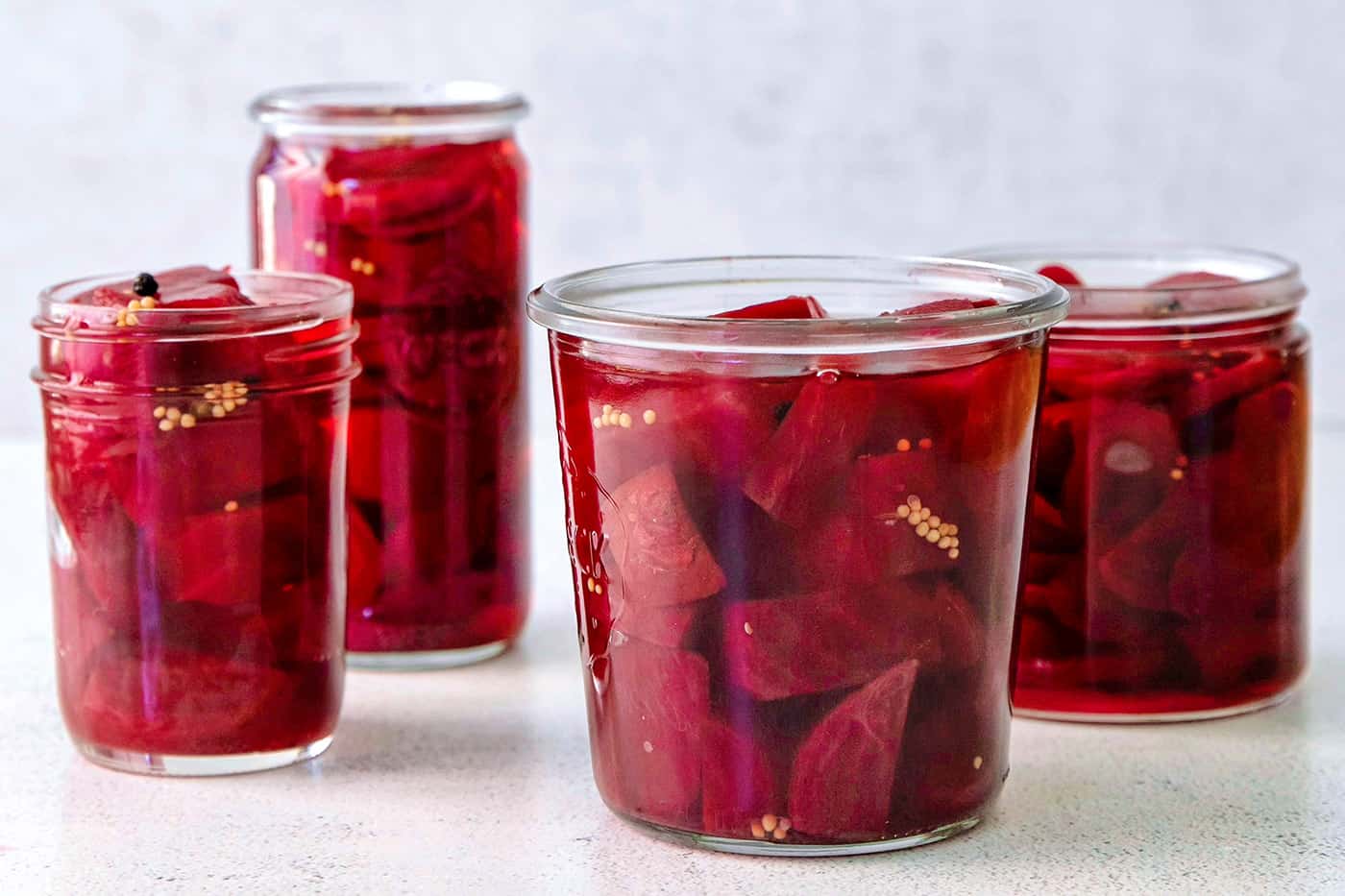 four jars of quick pickled beets