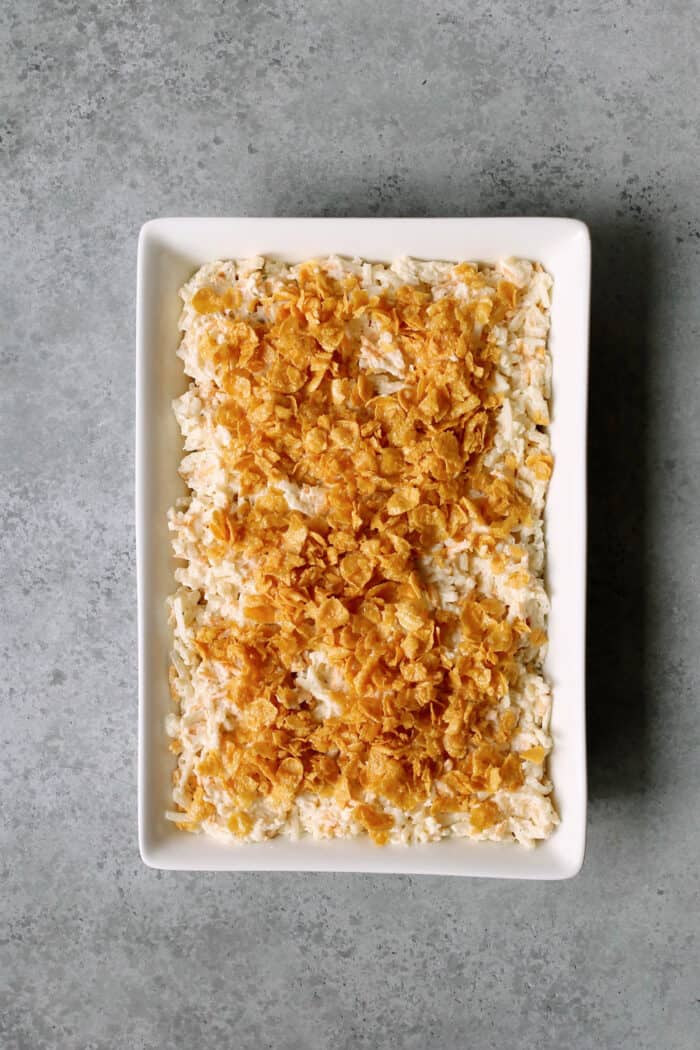 Cornflake topping sprinkled on top of a hashbrown casserole