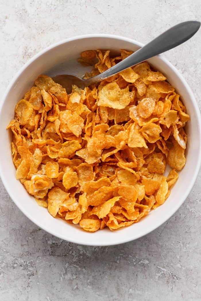 Cornflake mixture in bowl with spoon
