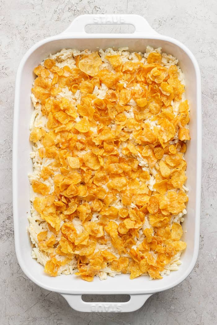 Overhead view of cheesy hashbrown casserole before baking