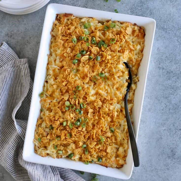 hashbrown casserole in a white rectangular baking dish