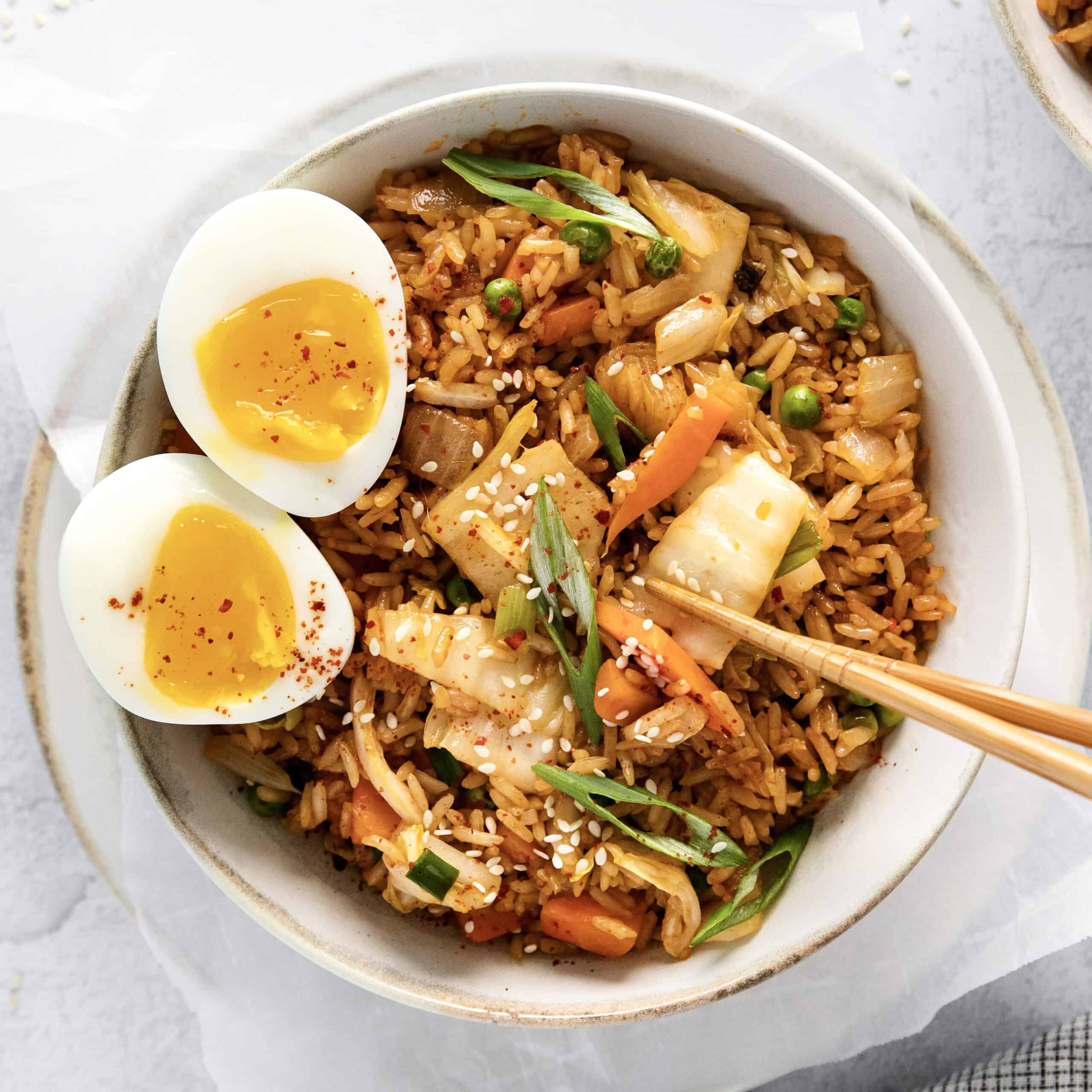 Overhead view of a bowl of kimchi fried rice