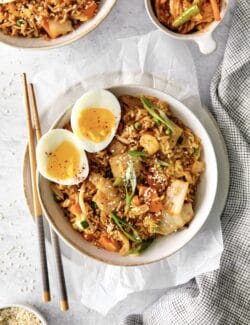 A bowl of kimchi fried rice with a soft boiled egg