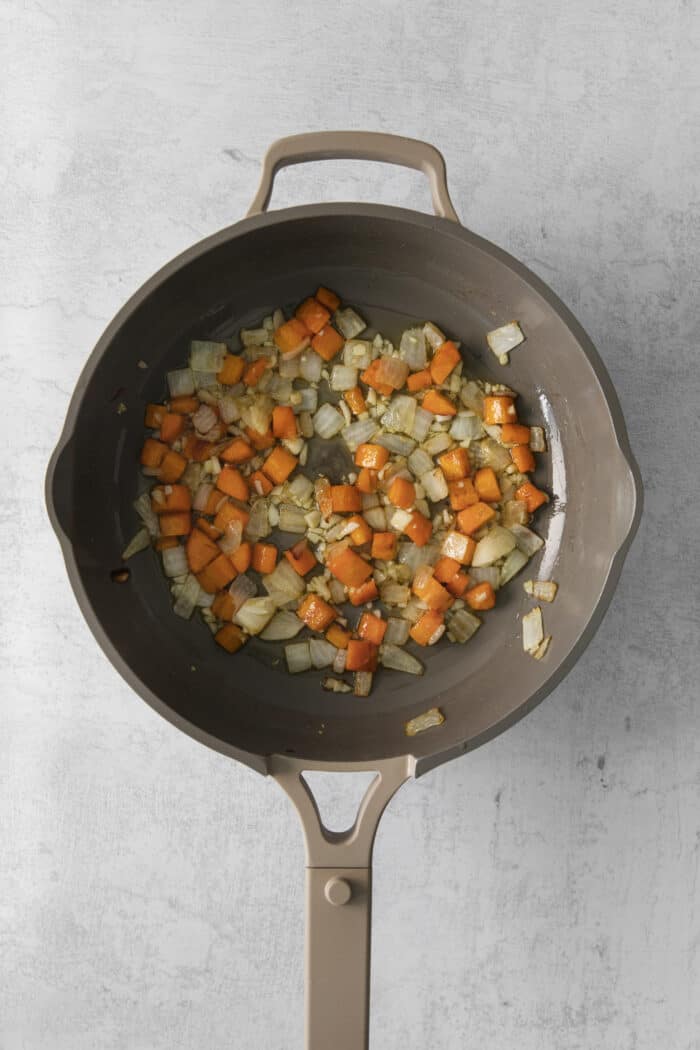 Carrots and shallots in a skillet
