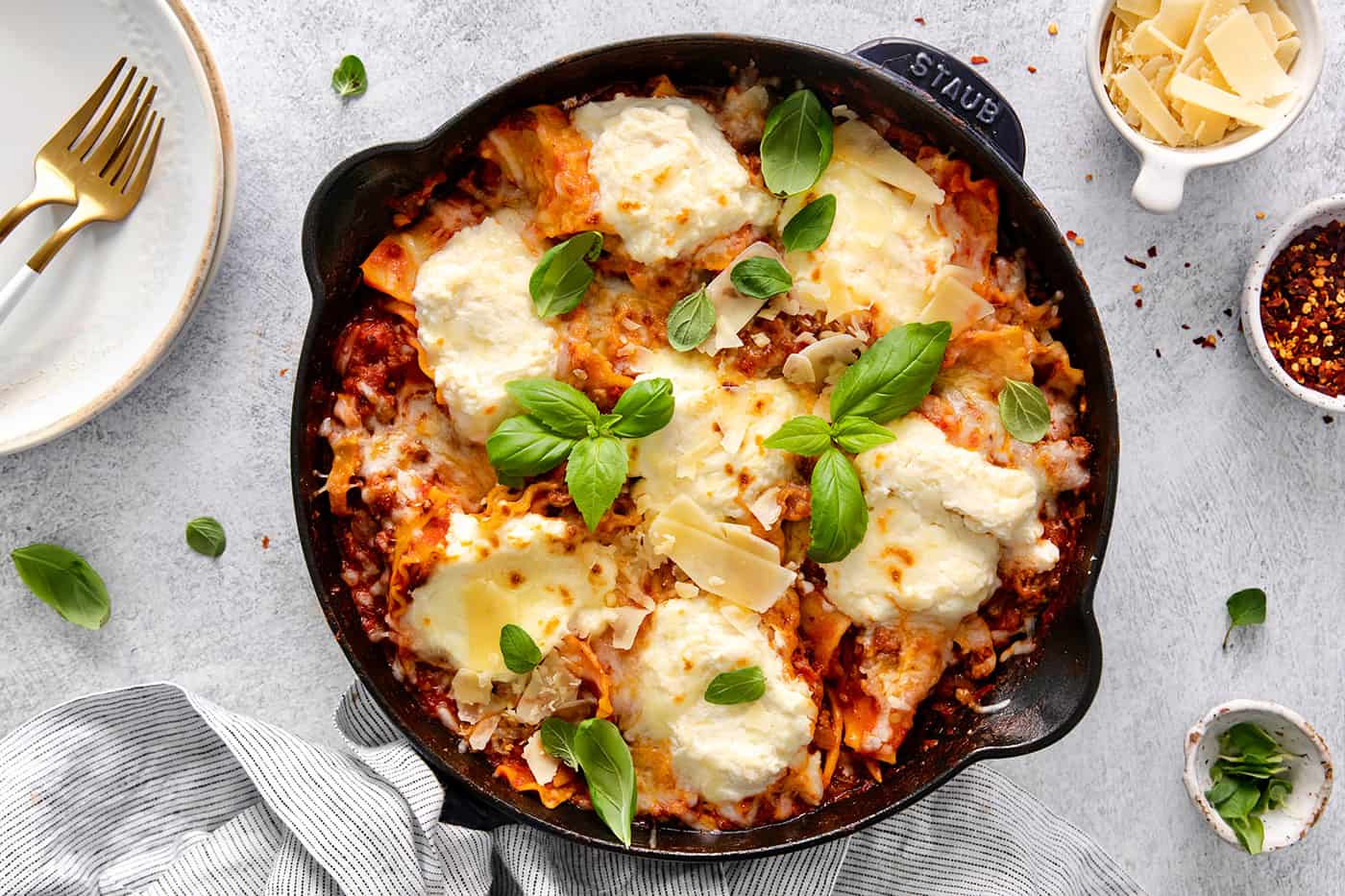 Overhead view of skillet lasagna garnished with fresh basil