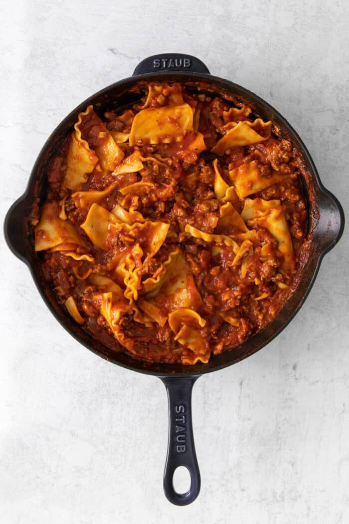 Lasagna noodles and sauce mixed together in a skillet