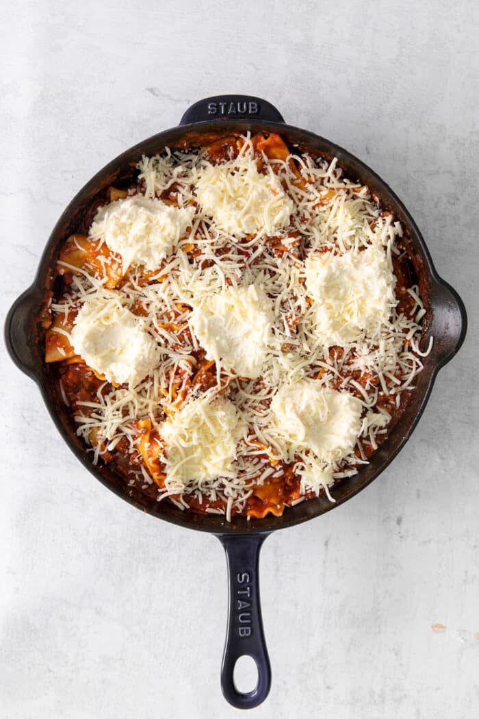 Mozzarella cheese topping a skillet lasagna