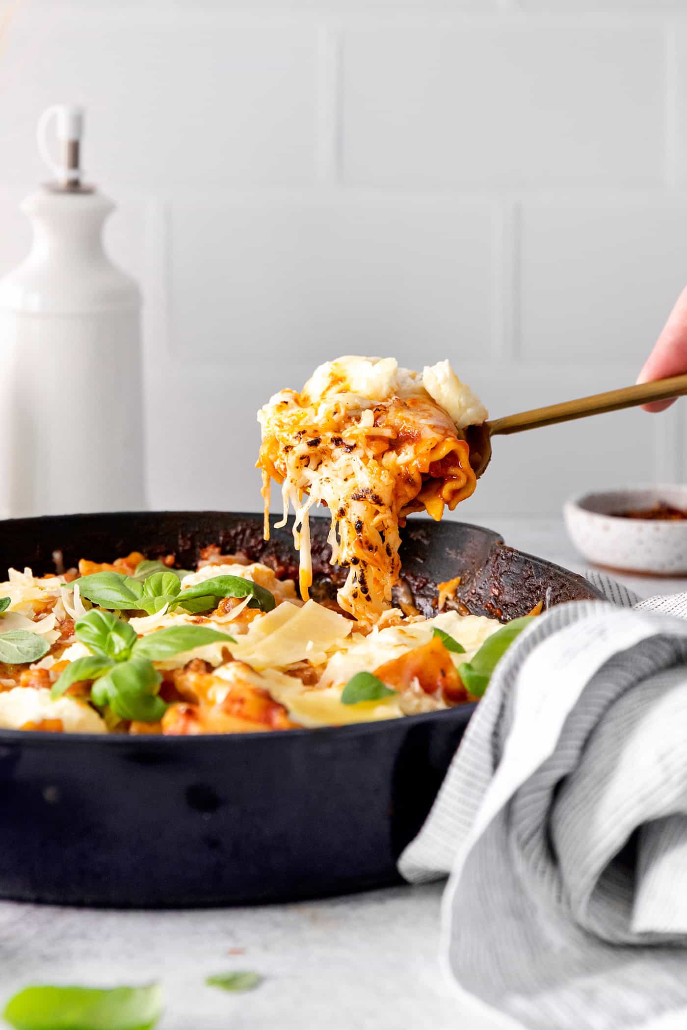 A spoon serving one pan lasagna