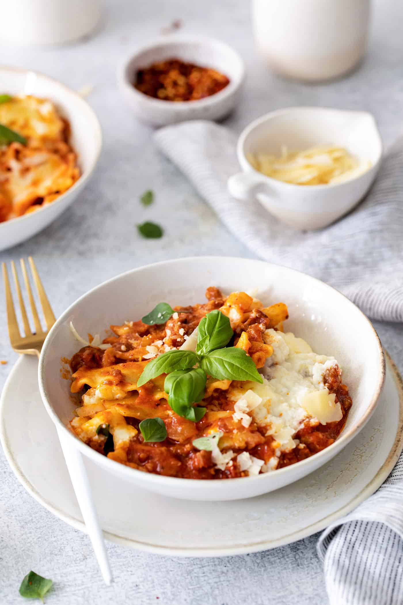 Angled view of a bowl of one pot lasagna