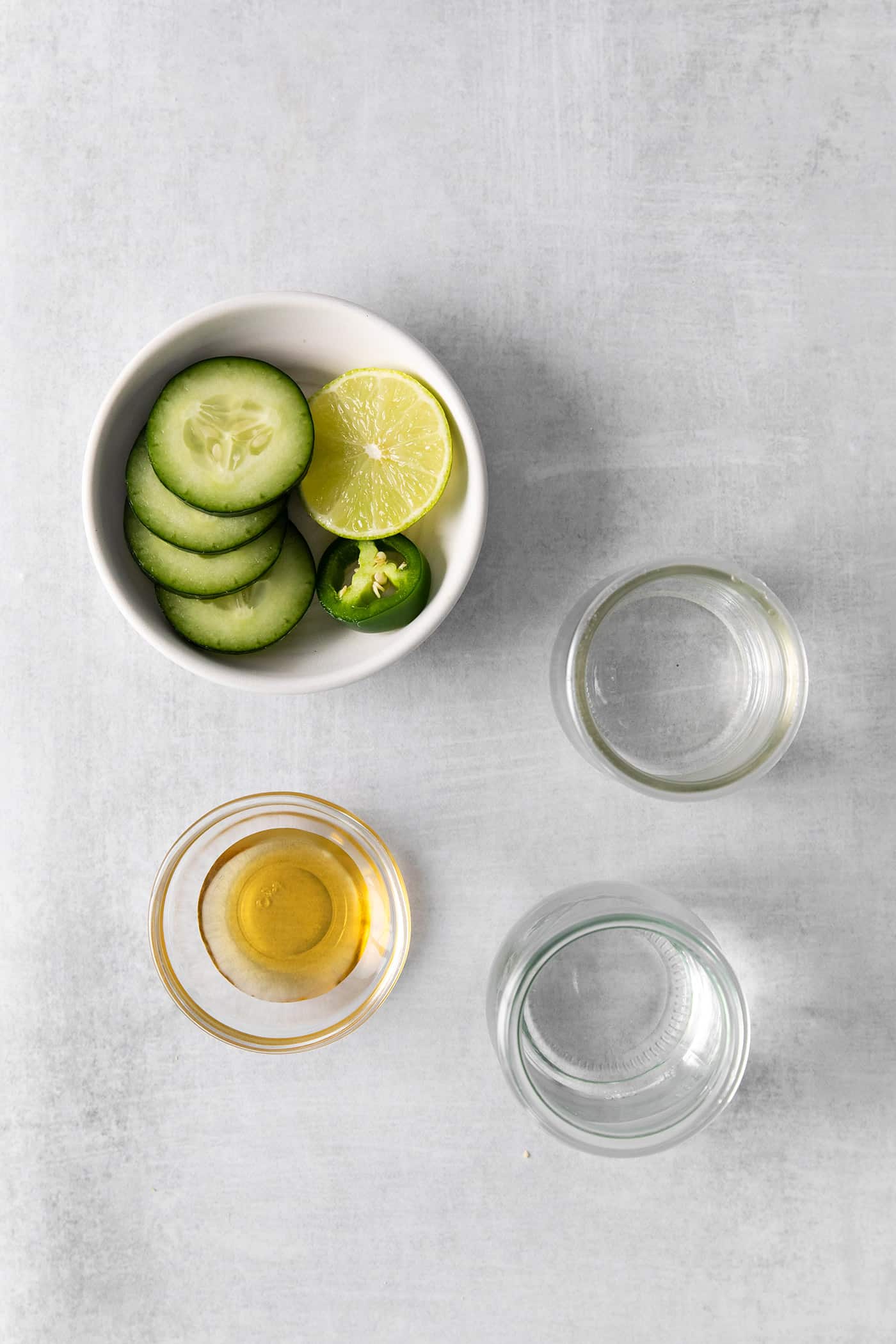 Overhead view of spicy cucumber margarita ingredients