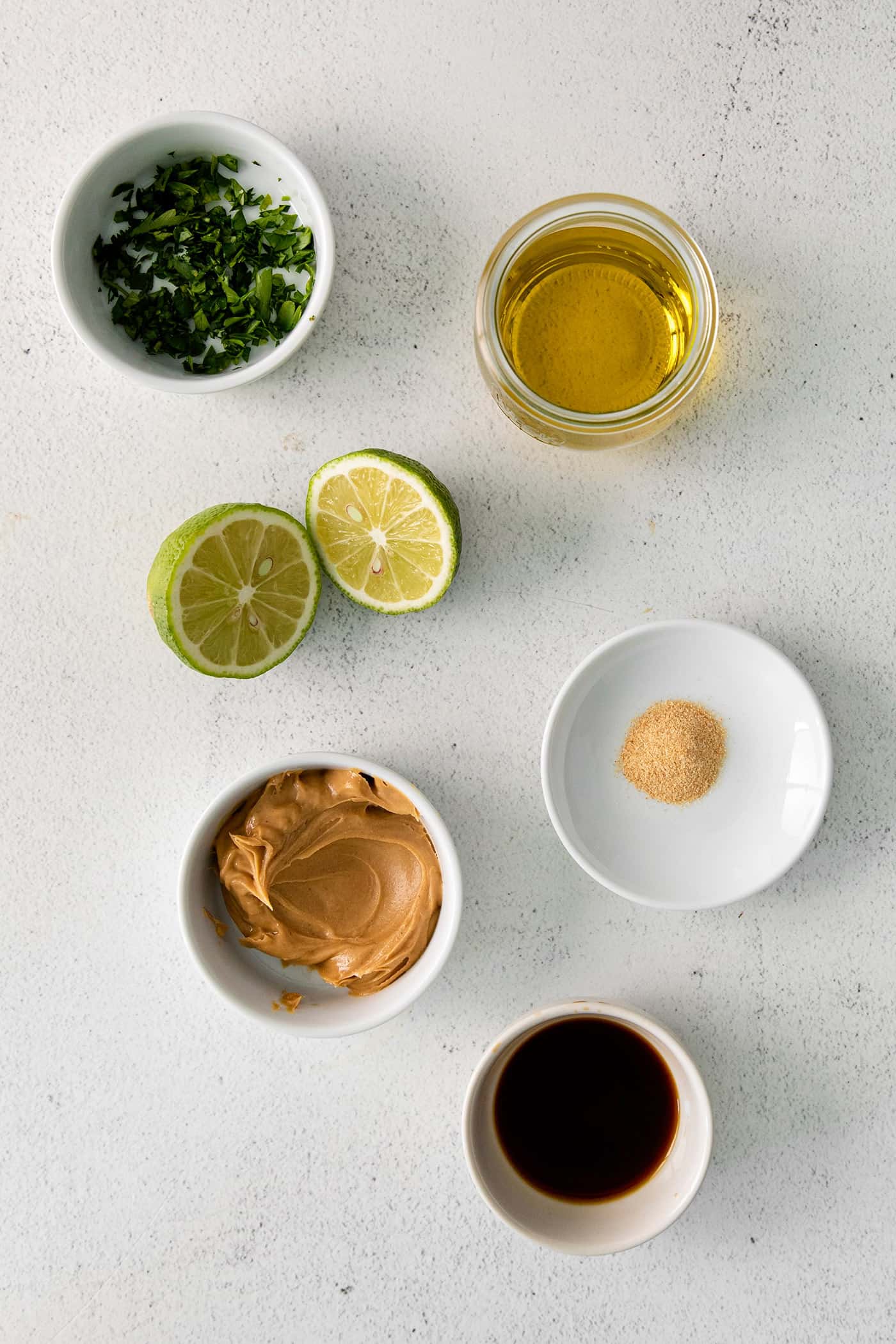 Overhead view of lime peanut sauce ingredients