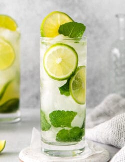 Two tequila mojitos in a tall glass