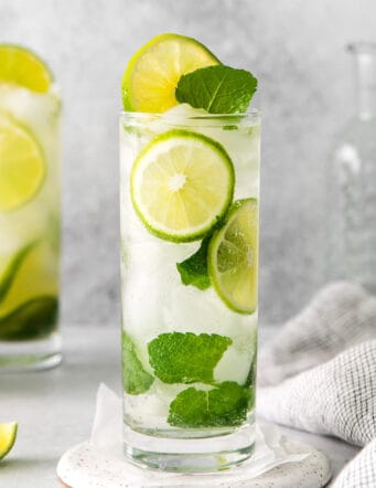 Two tequila mojitos in a tall glass