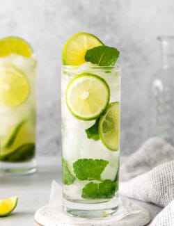 A lime tequila mojito in a tall glass