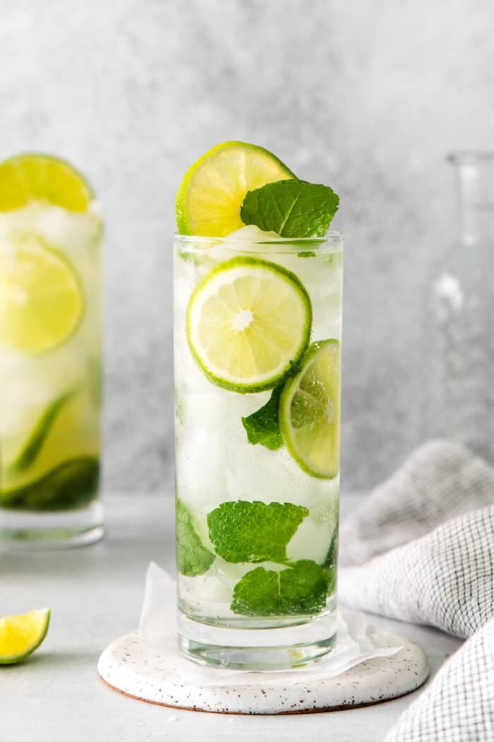 A lime tequila mojito in a tall glass