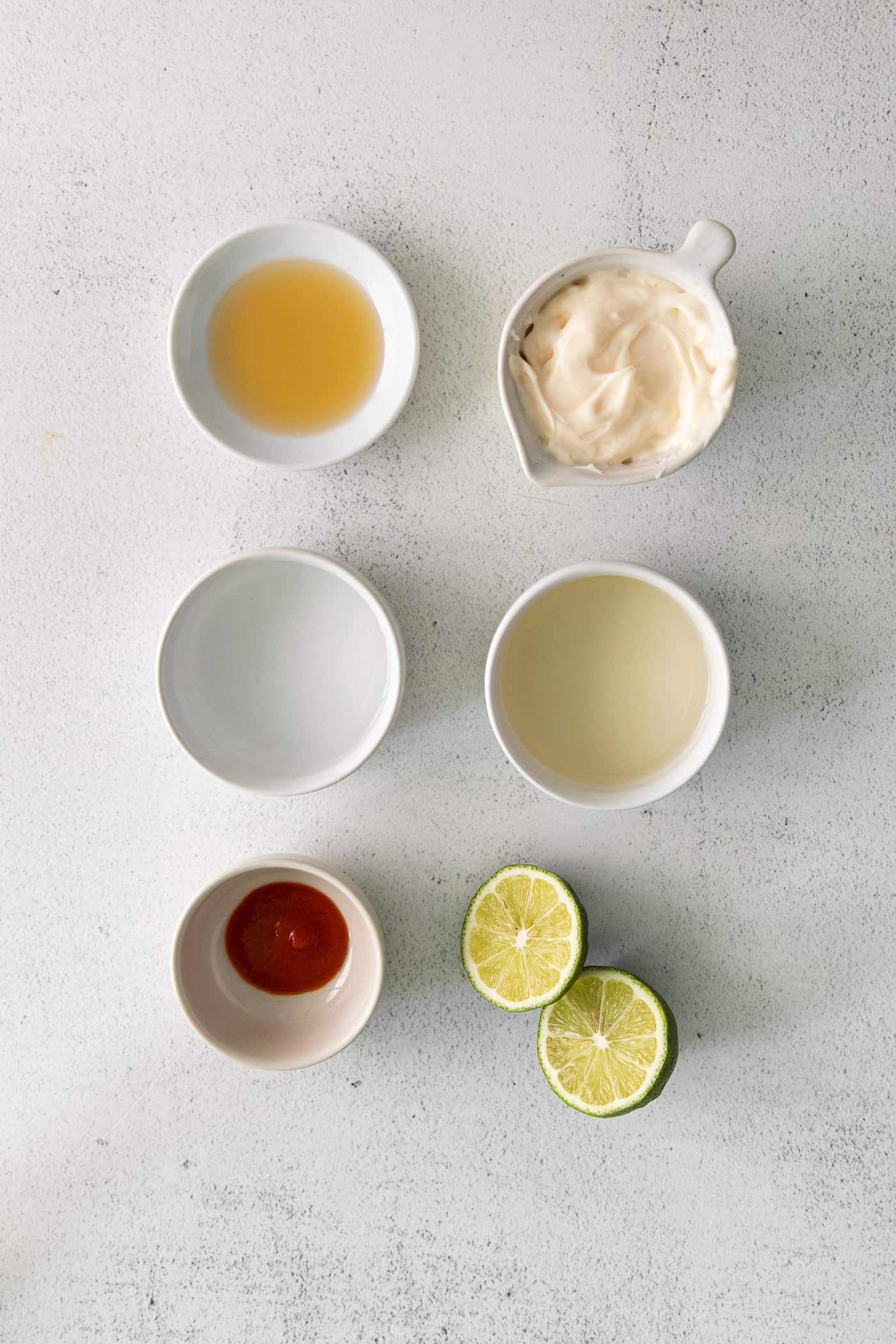 Overhead view of spicy mayonnaise vinaigrette ingredients